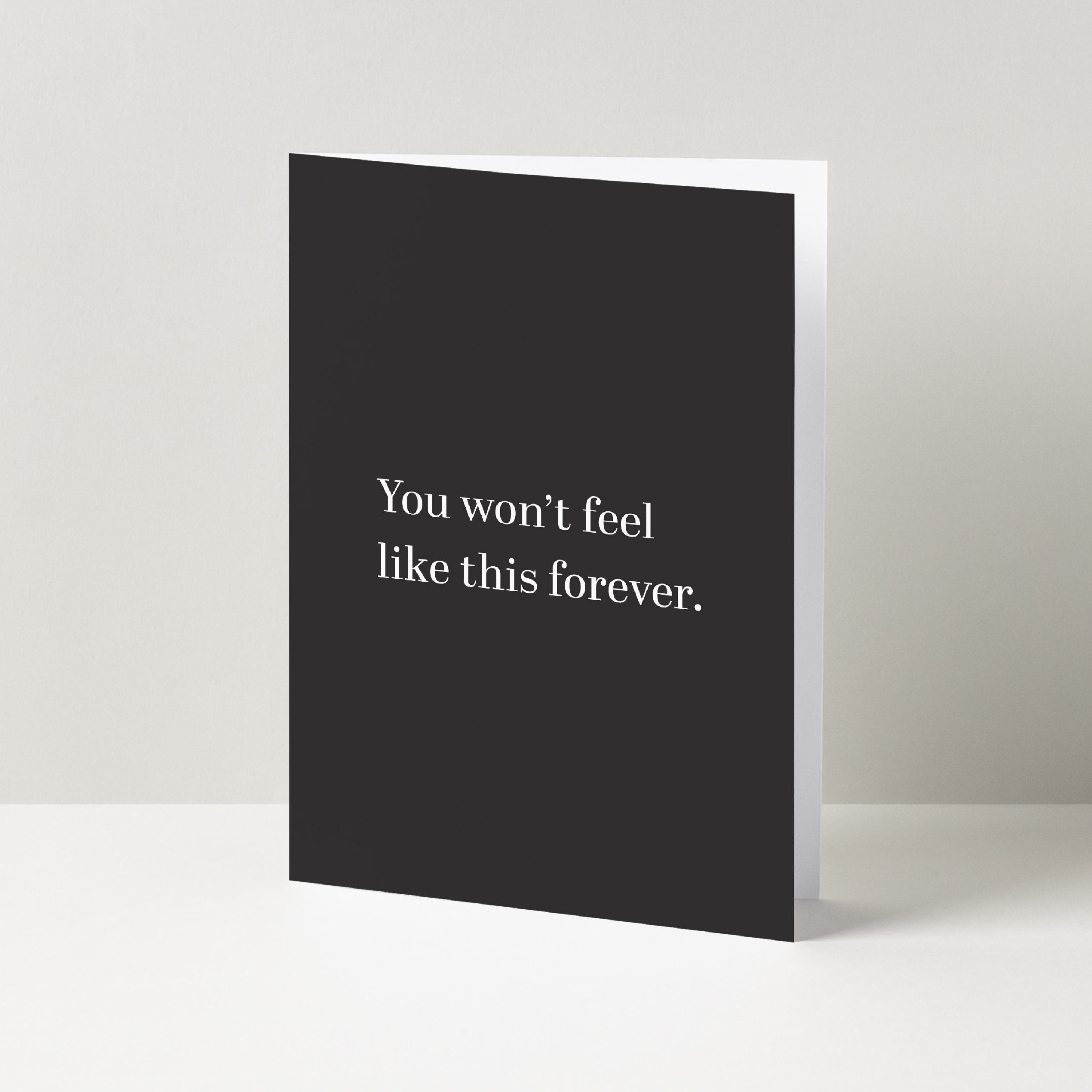 Vertical black card with the words "You won't feel like this forever" in a serif white font.